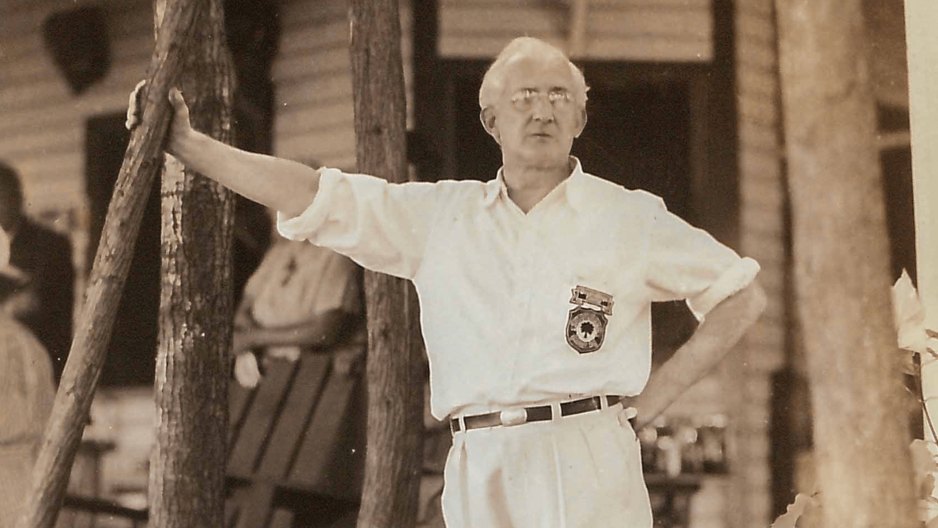 Sepia portrait of an older man wearing a white shirt.