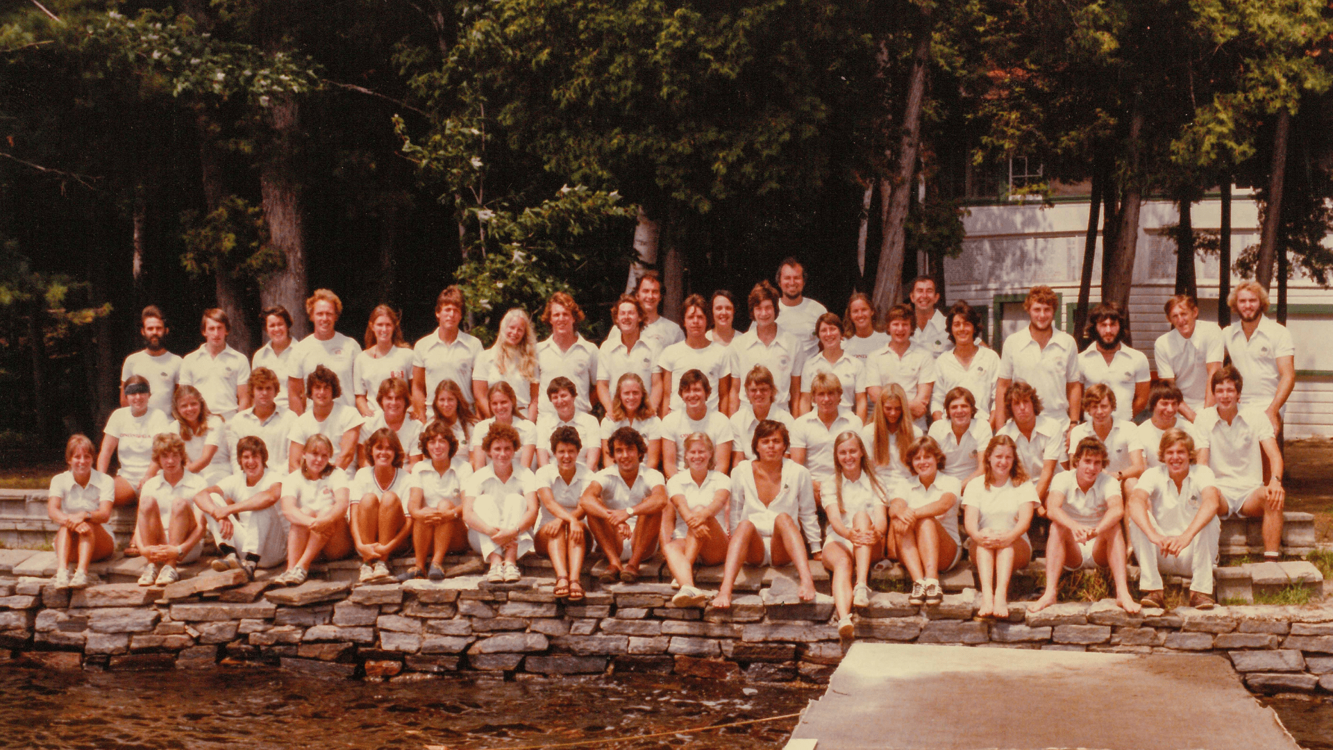 Large group of campers posing for a vintage group photo.